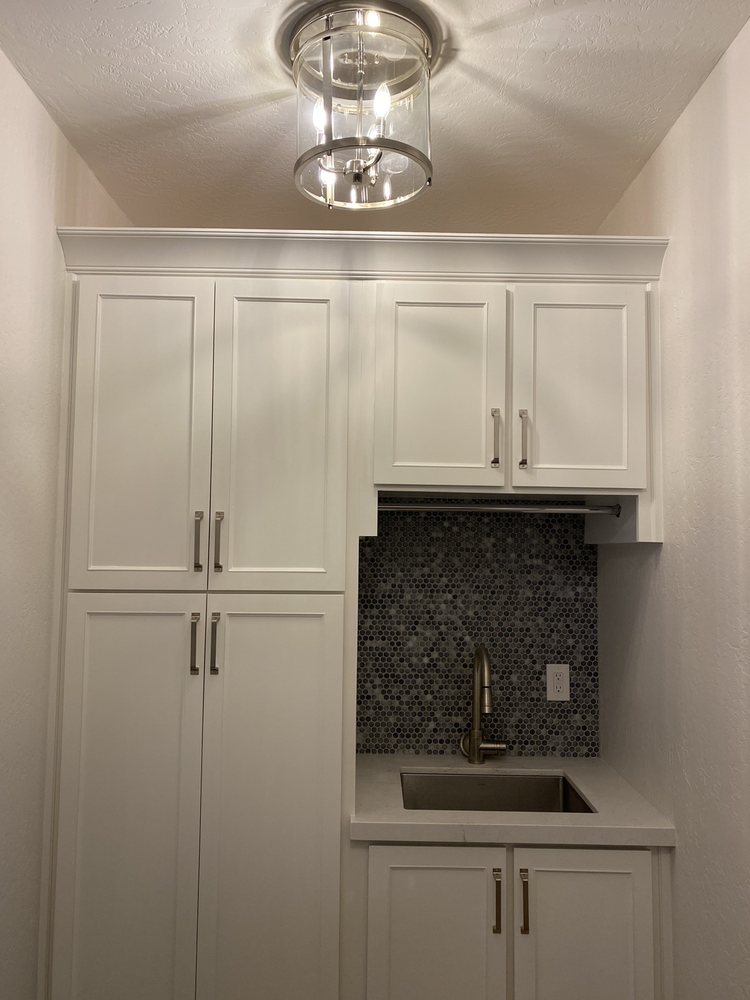 Laundry lighting fixture adds interest to a normally boring — Laundry by Urban Element, Inc. in the East Valley of Arizona